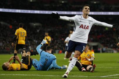 Tottenham Hotspurs Argentinian midfielder Erik Lamela celebrates after scoring their second goal during the English FA Cup fourth round replay football match between Tottenham Hotspur and Newport County at Wembley Stadium in London, on February 7, 2018. / AFP PHOTO / Ian KINGTON / RESTRICTED TO EDITORIAL USE. No use with unauthorized audio, video, data, fixture lists, club/league logos or live services. Online in-match use limited to 75 images, no video emulation. No use in betting, games or single club/league/player publications.  / 