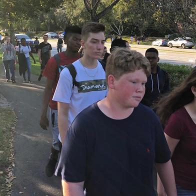 Students leave Marjory Stoneman Douglas High School in Parkland, Florida, a city about 50 miles (80 kilometers) north of Miami on February 14, 2018 following a school shooting.A gunman opened fire at the Florida high school, an incident that officials said caused numerous fatalities and left terrified students huddled in their classrooms, texting friends and family for help.The Broward County Sheriffs Office said a suspect was in custody. / AFP PHOTO / Michele Eve SANDBERG / The erroneous mention[s] appearing in the metadata of this photo by Michele Eve SANDBERG has been modified in AFP systems in the following manner: [Byline: Michele Eve SANDBERG] instead of [Eva Hambach]. Please immediately remove the erroneous mention from all your online services and delete it from your servers. If you have been authorized by AFP to distribute it to third parties, please ensure that the same actions are carried out by them. Failure to promptly comply with these instructions will entail liability on your part for any continued or post notification usage. Therefore we thank you very much for all your attention and prompt action. We are sorry for the inconvenience this notification may cause and remain at your disposal for any further information you may require.