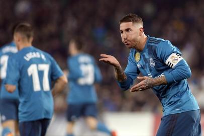 Real Madrids Spanish defender Sergio Ramos celebrates scoring a goal during the Spanish league football match Real Betis vs Real Madrid at the Benito Villamarin stadium in Sevilla on February 18, 2018. / AFP PHOTO / Cristina Quicler