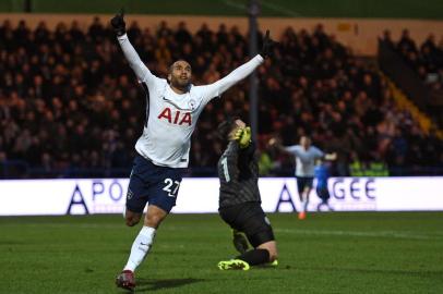 Tottenham Hotspurs Brazilian midfielder Lucas Moura celebrates after scoring their first goal during the English FA Cup fifth round football match between Rochdale and Tottenham Hotspur at the Crown Oil Arena in Rochdale, north west England on February 18, 2018. / AFP PHOTO / Oli SCARFF / RESTRICTED TO EDITORIAL USE. No use with unauthorized audio, video, data, fixture lists, club/league logos or live services. Online in-match use limited to 75 images, no video emulation. No use in betting, games or single club/league/player publications.  / 