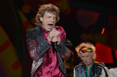  British singer and frontman of rock band The Rolling Stones Mick Jagger performs during a concert at Ciudad Deportiva in Havana, Cuba, on March 25, 2016. AFP PHOTO / YAMIL LAGE 