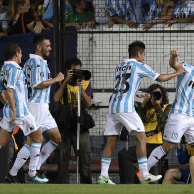 Argentinas Racing Club forward Lautaro Martinez (R) celebrates after scoring the teams second goal against Brazils Cruzeiro during the Copa Libertadores 2018 Group E first leg football at Juan Domingo Peron stadium in Buenos Aires, Argentina, on February 27, 2018. / AFP PHOTO / JUAN MABROMATA