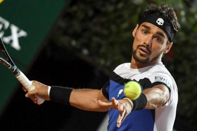 Italys Fabio Fognini returns the ball to Britains Andy Murray during their Rome ATP Tennis Open tournament match on May 16, 2017 at the Foro Italico in Rome.  / AFP PHOTO / ANDREAS SOLARO