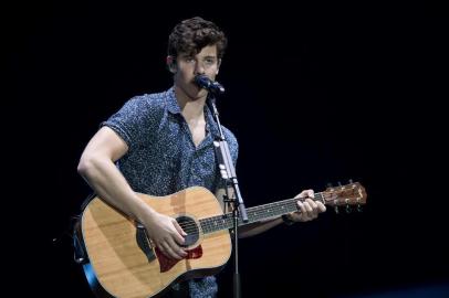 Shawn Mendes performs at the Rock in Rio Festival in the Olympic Park, Rio de Janeiro, Brazil, on September 16, 2017.Running for seven days in all -- Friday through Sunday and then September 21 to 24 / AFP PHOTO / Mauro PIMENTEL