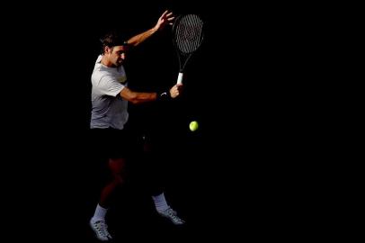 INDIAN WELLS, CA - MARCH 14: Roger Federer returns a shot to Jeremy Chardy of France during the BNP Paribas Open at the Indian Wells Tennis Garden on March 14, 2018 in Indian Wells, California.   Matthew Stockman/Getty Images/AFP