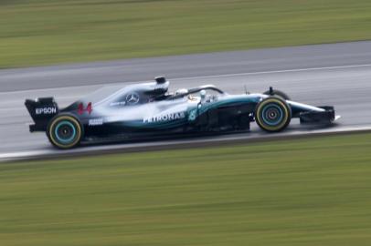 Mercedes AMG Petronas Formula One driver, Britains Lewis Hamilton test drives the new 2018 season Mercedes-AMG F1 W09 EQ Power+ Formula One car prior to the launch event at Silverstone motor racing circuit near Towcester, central England on February 22, 2018.  / AFP PHOTO / Justin TALLIS