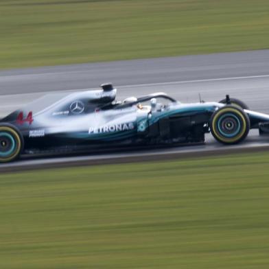 Mercedes AMG Petronas Formula One driver, Britains Lewis Hamilton test drives the new 2018 season Mercedes-AMG F1 W09 EQ Power+ Formula One car prior to the launch event at Silverstone motor racing circuit near Towcester, central England on February 22, 2018.  / AFP PHOTO / Justin TALLIS