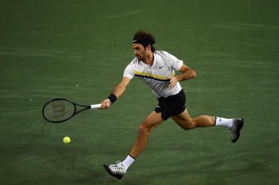 INDIAN WELLS, CA - MARCH 15: Roger Federer Switzerland stretches for a forehand against Hyeon Chung of Korea during Day 11 of BNP Paribas Open on March 15, 2018 in Indian Wells, California.   Kevork Djansezian/Getty Images/AFP