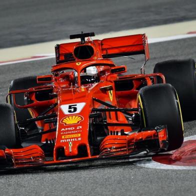 Ferraris German driver Sebastian Vettel drives during the second practice session ahead of the qualifiers for the Bahrain Formula One Grand Prix at the Sakhir circuit in Manama on April 6, 2018.  / AFP PHOTO / GIUSEPPE CACACE