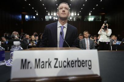 Facebook CEO Mark Zuckerberg Testifies At Joint Senate Commerce/Judiciary HearingWASHINGTON, DC - APRIL 10: Facebook co-founder, Chairman and CEO Mark Zuckerberg arrives to testify before a combined Senate Judiciary and Commerce committee hearing in the Hart Senate Office Building on Capitol Hill April 10, 2018 in Washington, DC. Zuckerberg, 33, was called to testify after it was reported that 87 million Facebook users had their personal information harvested by Cambridge Analytica, a British political consulting firm linked to the Trump campaign.   Chip Somodevilla/Getty Images/AFPEditoria: POLLocal: WashingtonIndexador: CHIP SOMODEVILLASecao: GovernmentFonte: GETTY IMAGES NORTH AMERICAFotógrafo: STF