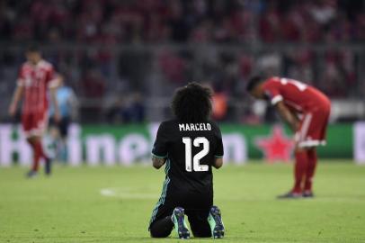 Real Madrids Brazilian defender Marcelo reacts at the end of the UEFA Champions League semi-final first-leg football match FC Bayern Munich v Real Madrid CF in Munich, southern Germany on April 25, 2018. / AFP PHOTO / JAVIER SORIANO