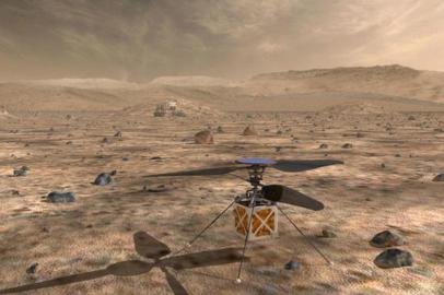 This handout illustration obtained May 11, 2018 courtesy of NASA shows an illustration of NASAs  Mars Helicopter, a small, autonomous rotorcraft, will travel with the agencys Mars 2020 rover mission, currently scheduled to launch in July 2020, to demonstrate the viability and potential of heavier-than-air vehicles on the Red Planet. Known simply as The Mars Helicopter, the device weighs less than four pounds (1.8 kilograms), and its main body section, or fuselage, is about the size of a softball. It will be attached to the belly pan of the Mars 2020 rover, a wheeled robot that aims to determine the habitability of the Martian environment, search for signs of ancient life, and assess natural resources and hazards for future human explorers. / AFP PHOTO / NASA / JPL-CALTECH / == RESTRICTED TO EDITORIAL USE  / MANDATORY CREDIT:  AFP PHOTO /  NASA/JPL-Caltech / NO MARKETING / NO ADVERTISING CAMPAIGNS /  DISTRIBUTED AS A SERVICE TO CLIENTS  ==