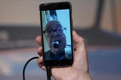  French-Swiss director Jean-Luc Godard addresses a press conference through a mobile phone video link, from his home in Switzerland, on May 12, 2018 for his film Le Livre dImage (Image Book) at the 71st edition of the Cannes Film Festival in Cannes, southern France.  / AFP PHOTO / Laurent EMMANUELEditoria: ACELocal: CannesIndexador: LAURENT EMMANUELSecao: film festivalFonte: AFPFotógrafo: STF