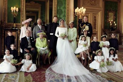 A picture released by Kensington Palace on behalf of The Duke and Duchess of Sussex on May 21, 2018 shows Britains Prince Harry, Duke of Sussex, (CL) and his wife Meghan, Duchess of Sussex, (CR) posing for an official wedding photograph with (L-R back row) Britains Camilla, Duchess of Cornwall, Britains Prince Charles, Prince of Wales, Doria Ragland, the Duchess of Sussexs mother, Britains Prince William, Duke of Cambridge, (middle row L-R): Master Jasper Dyer, Britains Prince Philip, Duke of Edinburgh, Britains Queen Elizabeth II, Britains Catherine, Duchess of Cambridge, Princess Charlotte of Cambridge, Prince George of Cambridge, Miss Rylan Litt, Master John Mulroney and (front row) Miss Ivy Mulroney, Master Brian Mulroney, Miss Florence van Cutsem, Miss Zalie Warren and Miss Remi Litt in the Green Drawing Room, Windsor Castle, in Windsor on May 19, 2018.  / AFP PHOTO / KENSINGTON PALACE /  / RESTRICTED TO EDITORIAL USE - MANDATORY CREDIT AFP PHOTO / THE DUKE AND DUCHESS OF SUSSEX / ALEXI LUBOMIRSKI  - NO MARKETING NO ADVERTISING CAMPAIGNS - NO COMMERCIAL USE - NO SALES - RESTRICTED TO SUBSCRIPTION USE - NO USE IN SOUVENIRS OR MEMORABILIA - NO CROPPING, ENHANCING OR DIGITAL MODIFICATION - NOT TO BE USED AFTER DECEMBER 31, 2018 - DISTRIBUTED AS A SERVICE TO CLIENTS / The erroneous mention[s] appearing in the metadata of this photo by Alexi Lubomirski has been modified in AFP systems in the following manner: [A picture released by Kensington Palace on behalf of The Duke and Duchess of Sussex on May 21, 2018 shows Britains Prince Harry, Duke of Sussex, (CL) and his wife Meghan, Duchess of Sussex, (CR) posing for an official wedding photograph with (L-R back row) Britains Camilla, Duchess of Cornwall, Britains Prince Charles, Prince of Wales, Doria Ragland, the Duchess of Sussexs mother, Britains Prince William, Duke of Cambridge, (middle row L-R): Master Jasper Dyer, Britains Prince Philip, Duke of Edinburgh, Britains Queen Elizab