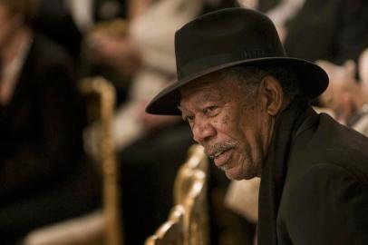 Actor Morgan Freeman listens during an event in the East Room of the White House December 2, 2012 in Washington, DC. Obama and US First Lady Michelle Obama attended the event at the White House with the 2012 Kennedy Center Honorees before to celebrate their contribution to the arts before heading to the Kennedy Center for the honors program.