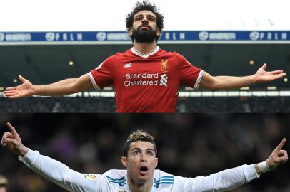 (COMBO) This combination of pictures created on May 23, 2018 shows Liverpools Egyptian midfielder Mohamed Salah on April 21, 2018 during an English Premier League football match in West Bromwich, and Real Madrids Portuguese forward Cristiano Ronaldo (bottom) during a Spanish league football match in Madrid on February 10, 2018.Real Madrid CF and Liverpool FC will play the UEFA Champions League final football match in Kiev on May 26, 2018. / AFP PHOTO / Lindsey PARNABY AND GABRIEL BOUYS / RESTRICTED TO EDITORIAL USE. No use with unauthorized audio, video, data, fixture lists, club/league logos or live services. Online in-match use limited to 75 images, no video emulation. No use in betting, games or single club/league/player publications.  / 