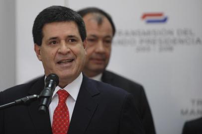 Paraguayan president elect Horacio Cartes speaks during the  introduction  of his ministers on August 12, 2013 in Asuncion.  Cartes takes up office as Paraguayan president on August 15. AFP PHOTO/NORBERTO DUARTE