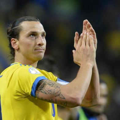 Sweden's team captain Zlatan Ibrahimovic celebrates after the FIFA 2014 World Cup group C qualifying football match Sweden vs Austria on October 11, 2013 in Solna near Stockholm. Sweden won 2-1. AFP PHOTO/JONATHAN NACKSTRAND