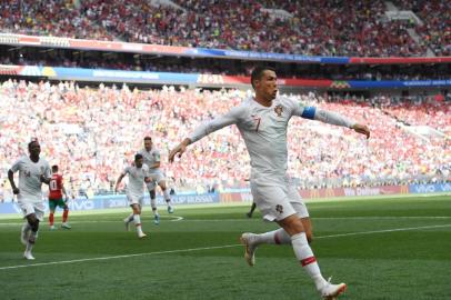  Portugal's forward Cristiano Ronaldo celebrates opening the scoring for Portugal during the Russia 2018 World Cup Group B football match between Portugal and Morocco at the Luzhniki Stadium in Moscow on June 20, 2018. / AFP PHOTO / Francisco LEONG / RESTRICTED TO EDITORIAL USE - NO MOBILE PUSH ALERTS/DOWNLOADSEditoria: SPOLocal: MoscowIndexador: FRANCISCO LEONGSecao: soccerFonte: AFPFotógrafo: STF