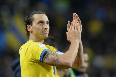 Swedens team captain Zlatan Ibrahimovic celebrates after the FIFA 2014 World Cup group C qualifying football match Sweden vs Austria on October 11, 2013 in Solna near Stockholm. Sweden won 2-1. AFP PHOTO/JONATHAN NACKSTRAND