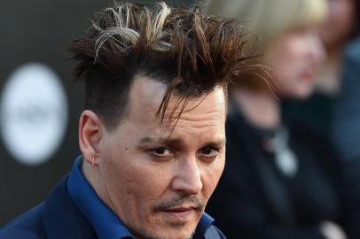 Actor Johnny Depp attends the premiere of Disneys Alice Through The Looking Glass, May 23, 2106 at the El Capitan Theatre in Hollywood, California. Robyn BECK / AFP