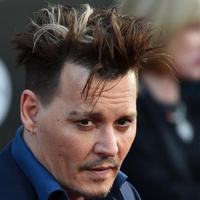 Actor Johnny Depp attends the premiere of Disneys Alice Through The Looking Glass, May 23, 2106 at the El Capitan Theatre in Hollywood, California. Robyn BECK / AFP