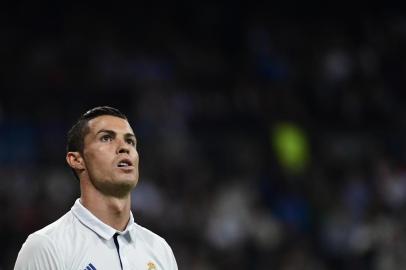 Real Madrids Portuguese forward Cristiano Ronaldo looks on during the UEFA Champions League football match Real Madrid CF vs Legia  Legia Warszawa at the Santiago Bernabeu stadium in Madrid on October 18, 2016. / AFP PHOTO / PIERRE-PHILIPPE MARCOU