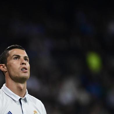 Real Madrids Portuguese forward Cristiano Ronaldo looks on during the UEFA Champions League football match Real Madrid CF vs Legia  Legia Warszawa at the Santiago Bernabeu stadium in Madrid on October 18, 2016. / AFP PHOTO / PIERRE-PHILIPPE MARCOU