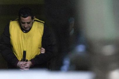 Chilean priest Oscar Munoz Toledo leaves a courtroom in Rancagua, 80 km south of Santiago, Chile, on July 13, 2018. Prominent Chilean Catholic priest Oscar Munoz, who held senior positions in the archdiocese of Santiago, was detained Thursday over allegations that he sexually abused seven children -- the latest pedophilia scandal to grip the countrys church. / AFP PHOTO / CLAUDIO REYES