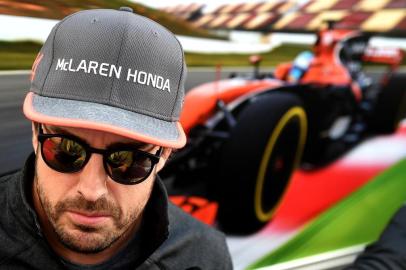 (FILES) In this file photo taken on April 27, 2017 McLarens Spanish driver Fernando Alonso answers journalists questions in the paddock at the Sochi Autodrom circuit in Sochi on April 27, 2017.Fernando Alonso will retire from Formula 1 at the end of the season McLaren announced on August 14, 2018. / AFP PHOTO / ANDREJ ISAKOVIC