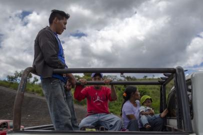 Venezuelans on a truck cross the border from Venezuela to Pacaraima, Roraima, Brazil, on August 20, 2018. Desperate Venezuelans fleeing the countrys crisis continue to cross the Brazilian border, despite the violent anti-migrant riot that took place last week in the border town of Pacaraima.Mauro Pimentel / AFP