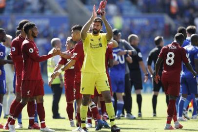 Liverpools Brazilian goalkeeper Alisson Becker gestures after the final whistle during the English Premier League football match between Leicester City and Liverpool at King Power Stadium in Leicester, central England on September 1, 2018. / AFP PHOTO / Adrian DENNIS / RESTRICTED TO EDITORIAL USE. No use with unauthorized audio, video, data, fixture lists, club/league logos or live services. Online in-match use limited to 120 images. An additional 40 images may be used in extra time. No video emulation. Social media in-match use limited to 120 images. An additional 40 images may be used in extra time. No use in betting publications, games or single club/league/player publications. / 