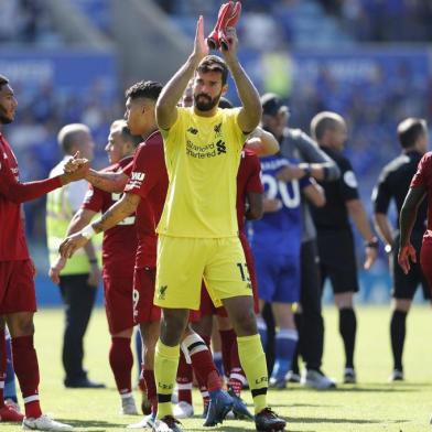 Liverpools Brazilian goalkeeper Alisson Becker gestures after the final whistle during the English Premier League football match between Leicester City and Liverpool at King Power Stadium in Leicester, central England on September 1, 2018. / AFP PHOTO / Adrian DENNIS / RESTRICTED TO EDITORIAL USE. No use with unauthorized audio, video, data, fixture lists, club/league logos or live services. Online in-match use limited to 120 images. An additional 40 images may be used in extra time. No video emulation. Social media in-match use limited to 120 images. An additional 40 images may be used in extra time. No use in betting publications, games or single club/league/player publications. / 