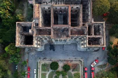 Drone view of Rio de Janeiros treasured National Museum, one of Brazils oldest, on September 3, 2018, a day after a massive fire ripped through the building. The majestic edifice stood engulfed in flames as plumes of smoke shot into the night sky, while firefighters battled to control the blaze that erupted around 2230 GMT. Five hours later they had managed to smother much of the inferno that had torn through hundreds of rooms, but were still working to extinguish it completely, according to an AFP photographer at the scene. / AFP PHOTO / Mauro Pimentel