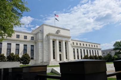 This file photo taken on August 1, 2015 shows the US Federal Reserve building in Washington, DC. The Federal Reserve kept its key interest rate unchanged June 15, 2016 but indicated that despite slower economic growth it could still raise the rate twice this year. The Fed cut its growth outlook for the United States to 2.0 percent for this year and 2017, but also indicated it sees inflation picking up slightly this year that would support a higher federal funds 