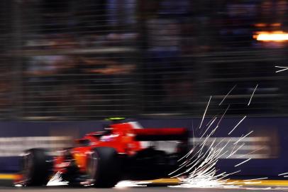 Ferraris Finnish driver Kimi Raikkonen drives during the second practice session at the Marina Bay Street Circuit ahead of the Singapore Formula One Grand Prix in Singapore on September 14, 2018. / AFP PHOTO / Manan VATSYAYANA