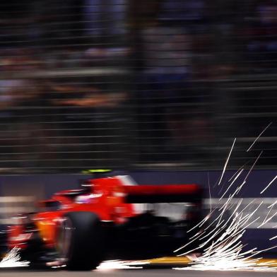 Ferraris Finnish driver Kimi Raikkonen drives during the second practice session at the Marina Bay Street Circuit ahead of the Singapore Formula One Grand Prix in Singapore on September 14, 2018. / AFP PHOTO / Manan VATSYAYANA