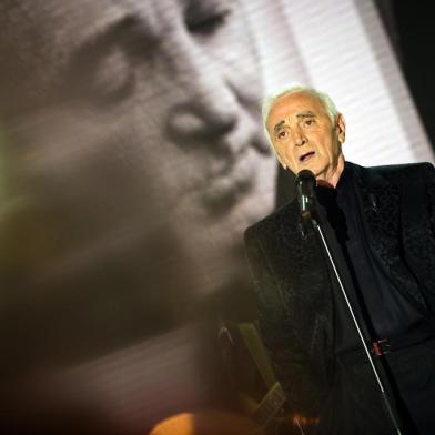 Armenian French singer Charles Aznavour takes part in the recording of the TV broadcast show Vivement Dimanche on August 30, 2011 in the studios of French channel France 2 in Paris. AFP PHOTO / LIONEL BONAVENTURE