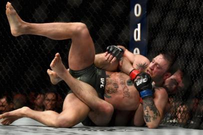 LAS VEGAS, NV - OCTOBER 06: Khabib Nurmagomedov of Russia holds down Conor McGregor of Ireland in their UFC lightweight championship bout during the UFC 229 event inside T-Mobile Arena on October 6, 2018 in Las Vegas, Nevada.   Harry How/Getty Images/AFP