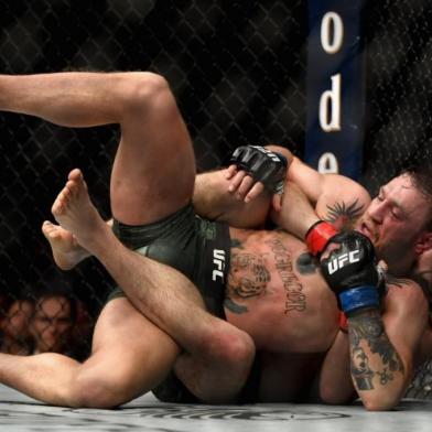 LAS VEGAS, NV - OCTOBER 06: Khabib Nurmagomedov of Russia holds down Conor McGregor of Ireland in their UFC lightweight championship bout during the UFC 229 event inside T-Mobile Arena on October 6, 2018 in Las Vegas, Nevada.   Harry How/Getty Images/AFP