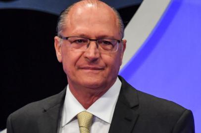 Brazilian presidential candidate for the Social Democratic Party of Brazil (PSDB) Geraldo Alckmin, smiles during the presidential debate ahead of the October 7 general election, at SBT television network in Osasco, metropolitan area of Sao Paulo, Brazil, on September 26, 2018.Leftist candidate Fernando Haddad is gaining ground in Brazils presidential election campaign, with a poll showing Monday that he would beat right-wing frontrunner Jair Bolsonaro in a second round runoff. / AFP PHOTO / NELSON ALMEIDA