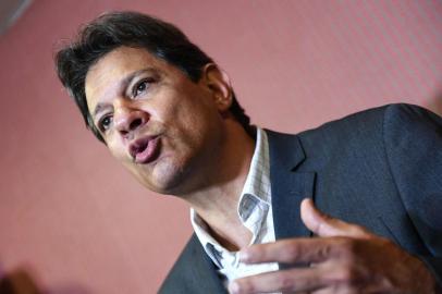 Brazil's presidential candidate for the Workers' Party (PT), Fernando Haddad, speaks during a press conference after a meeting at the Brazilian National Conference of Bishops, in Brasilia on October 11, 2018. (Photo by EVARISTO SA / AFP)