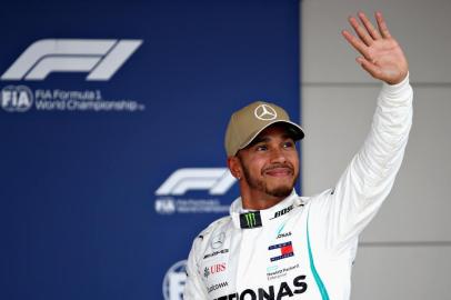 AUSTIN, TX - OCTOBER 20: Pole position qualifier Lewis Hamilton of Great Britain and Mercedes GP celebrates in parc ferme during qualifying for the United States Formula One Grand Prix at Circuit of The Americas on October 20, 2018 in Austin, United States.   Mark Thompson/Getty Images/AFP