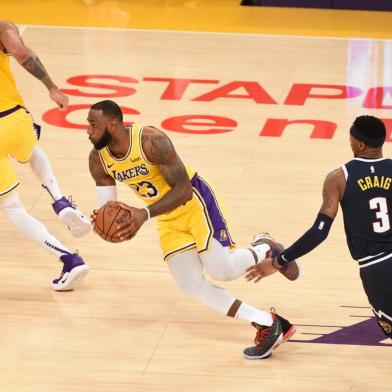 LOS ANGELES, CA - OCTOBER 25: LeBron James #23 of the Los Angeles Lakers against the Denver Nuggets on October 25, 2018 at Staples Center in Los Angeles, California. NOTE TO USER: User expressly acknowledges and agrees that, by downloading and/or using this photograph, User is consenting to the terms and conditions of the Getty Images License Agreement. Mandatory Copyright Notice: Copyright 2018 NBAE   Adam Pantozzi/NBAE via Getty Images/AFP