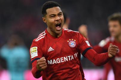 Bayern Munichs midfielder Serge Gnabry celebrates after scoring during the German first division Bundesliga match between FC Bayern Munich and SC Freiburg in Munich, southern Germany, on November 3, 2018. (Photo by Christof STACHE / AFP) / RESTRICTIONS: DFL REGULATIONS PROHIBIT ANY USE OF PHOTOGRAPHS AS IMAGE SEQUENCES AND/OR QUASI-VIDEO