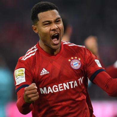 Bayern Munichs midfielder Serge Gnabry celebrates after scoring during the German first division Bundesliga match between FC Bayern Munich and SC Freiburg in Munich, southern Germany, on November 3, 2018. (Photo by Christof STACHE / AFP) / RESTRICTIONS: DFL REGULATIONS PROHIBIT ANY USE OF PHOTOGRAPHS AS IMAGE SEQUENCES AND/OR QUASI-VIDEO