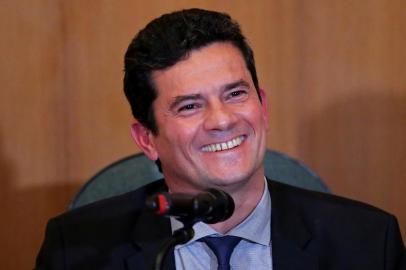 Brazilian Federal Judge Sergio Moro, incoming Brazilian Justice and Public Security Minister, smiles during a press conference at the Federal Justice Court in Curitiba, Brazil on November 06, 2018. (Photo by Heuler Andrey / AFP)