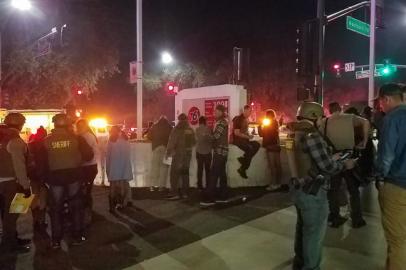 This photo obtained on November 8, 2018 courtesy of Jeremy Childs twitter account shows police officers interviewing people outside a country music bar and dance hall in Thousand Oaks, in the Los Angeles-area, after a gunman barged into a large, crowded venue and opened fire late November 7, wounding at least 11 people including a police officer, US police said. The venue in a quiet, upscale residential suburb was hosting an event for college students, with possibly several hundred young people in attendance, Captain Garo Kuredjian of the Ventura County Sheriff's office said.