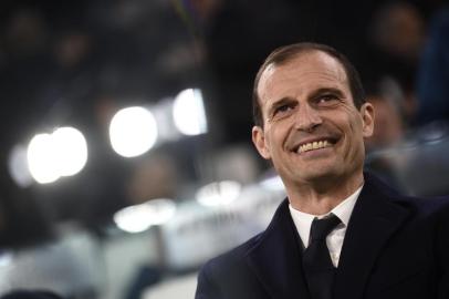 Juventus coach from Italy Massimiliano Allegri looks on during the UEFA Champions League round of sixteen first leg football match between Juventus and Tottenham Hotspur at The Allianz Stadium in Turin on February 13, 2018.  / AFP PHOTO / Marco BERTORELLO