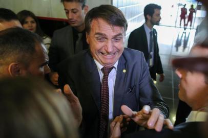 Brazils President-elect Jair Bolsonaro greets people during his visit to the Superior Court of Labour in Brasilia, on November 13, 2018. - Bolsonaro, who takes office on January 1, 2019, announced on Tuesday the appointment of reservist general Fernando Azevedo e Silva to the post of defense minister. (Photo by Sergio LIMA / AFP)